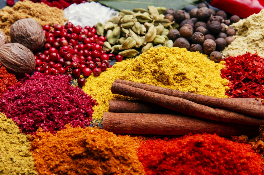 assortment of spices seasoning on a black stone